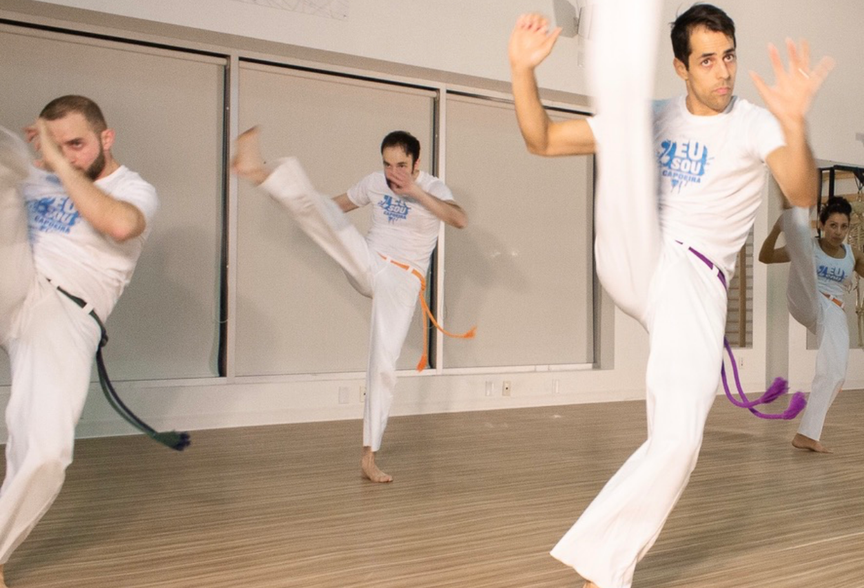 capoeira class teaching high kicks